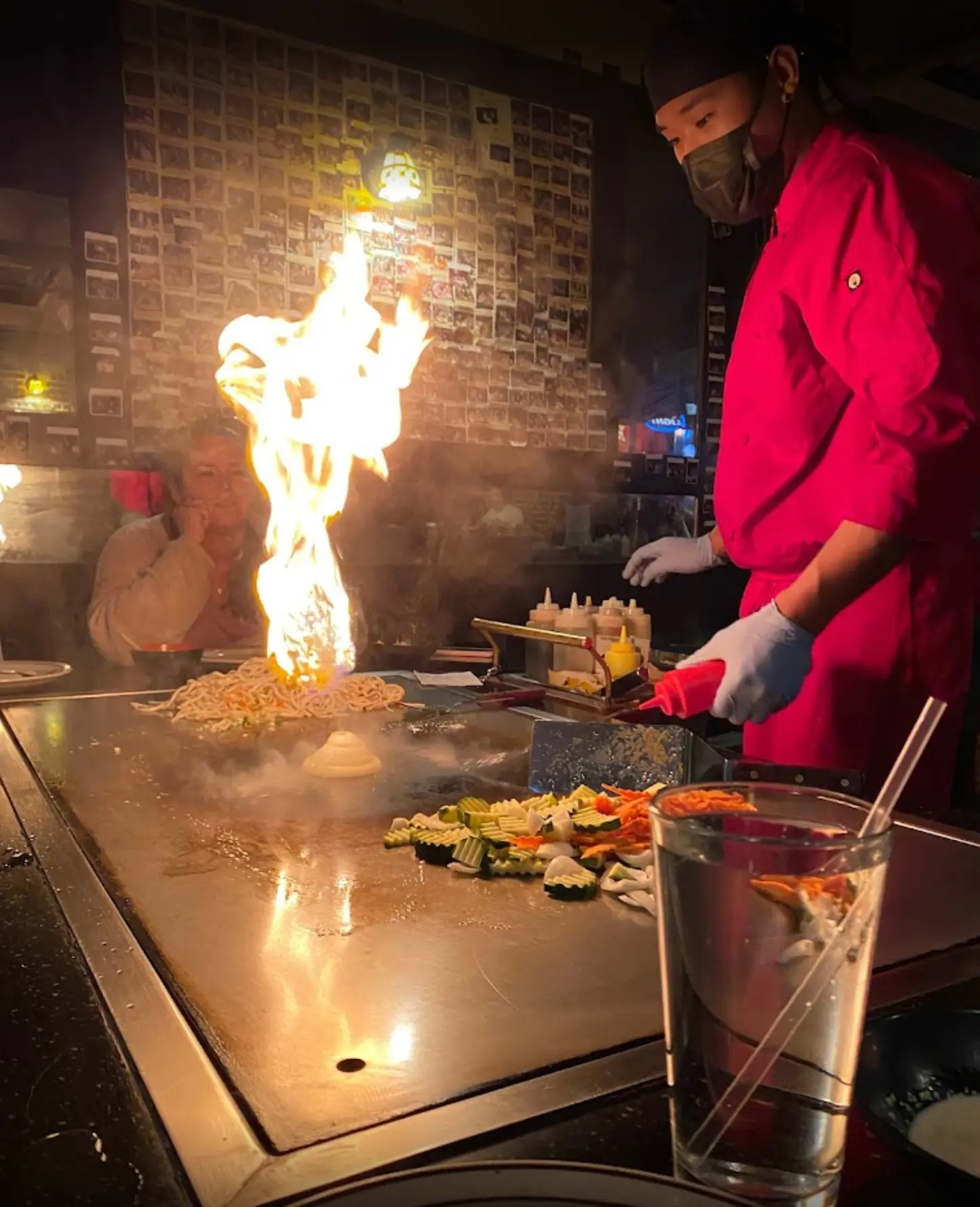 Hibachi chef cooking with high flames
