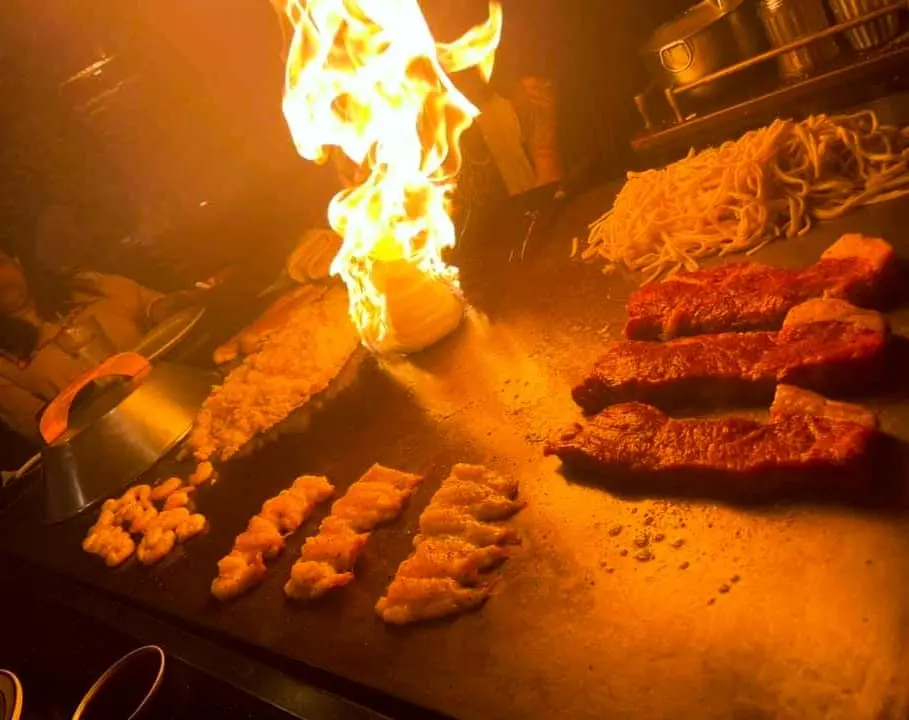 Chef cooking food on the grill